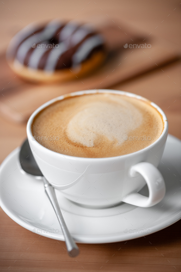 Cup of coffee and chocolate donut - Stock Photo - Images