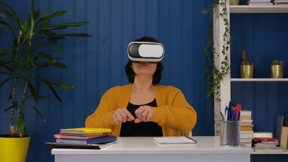 Excited Middle Aged Woman Wearing Vr Glasses Playing Online in Metaverse