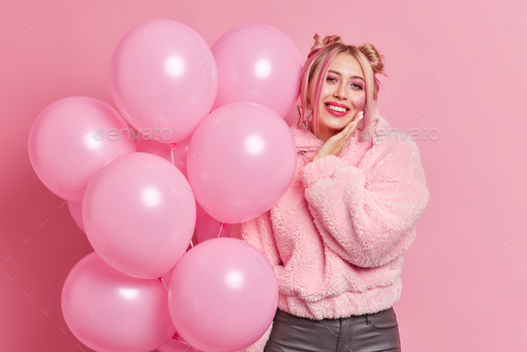 Pretty Birthday Girl, a Happy Woman, Blowing Out a Candle on Cake, Posing  with Pink Pastel Balloons on Color Background Stock Image - Image of  anniversary, cheerful: 271245541