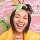 Close up shot of ethnic teenage girl smiles broadly dressed in street style has tendy dreadlocks hai - PhotoDune Item for Sale