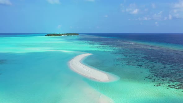 Daytime overhead abstract shot of a sandy white paradise beach and aqua turquoise water background i alt