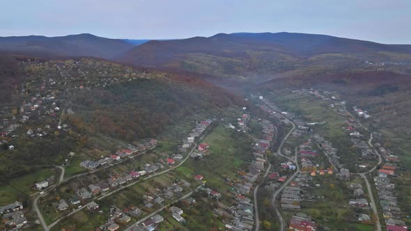 Panorama on small village in a mountain valley of the Carpathian mountains an autumn seasonal time alt