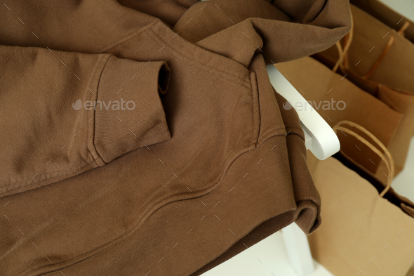 Brown hoodie and paper bags, close up