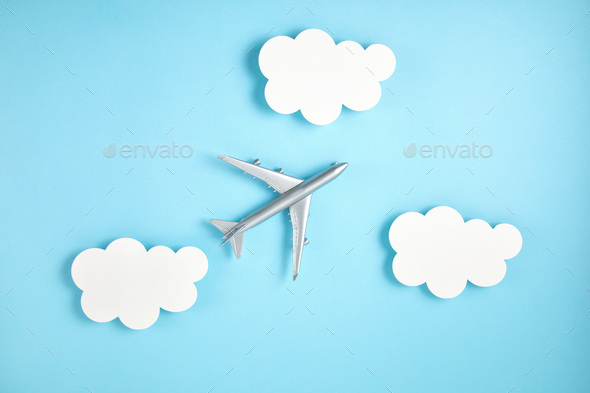Miniature airplane. Travel tourism, airlines, low cost flights concept. Top view, flat lay