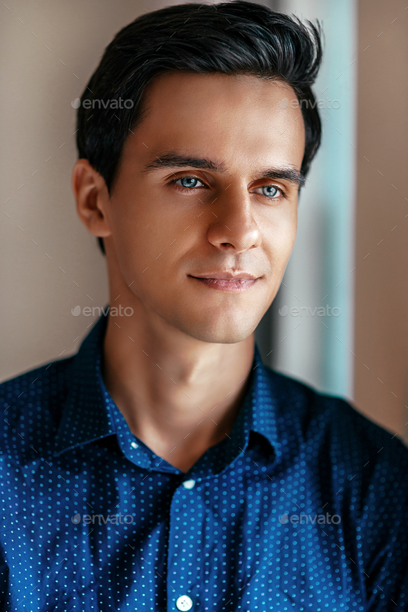 Portrait Of A Nice Young Attractive Man With Blue Eyes Stock Photo