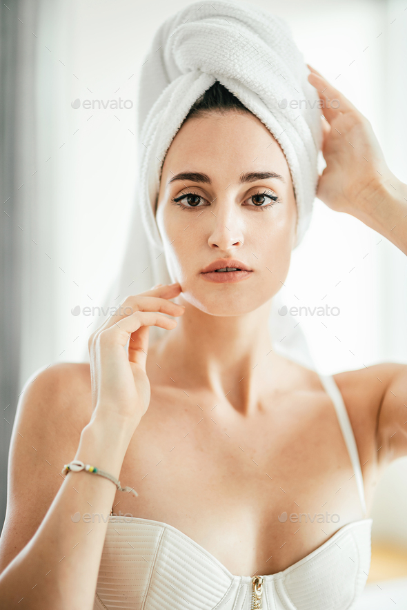 Premium Photo  Attractive young woman with towels is relaxing in