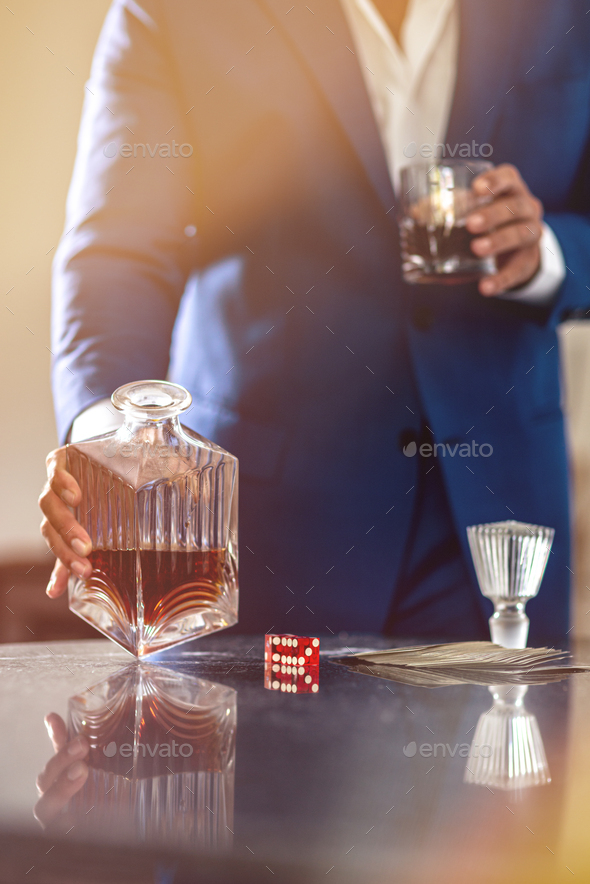 Be a thinker not a drinker. An elegant man suffering from alcoholism - Stock Photo - Images