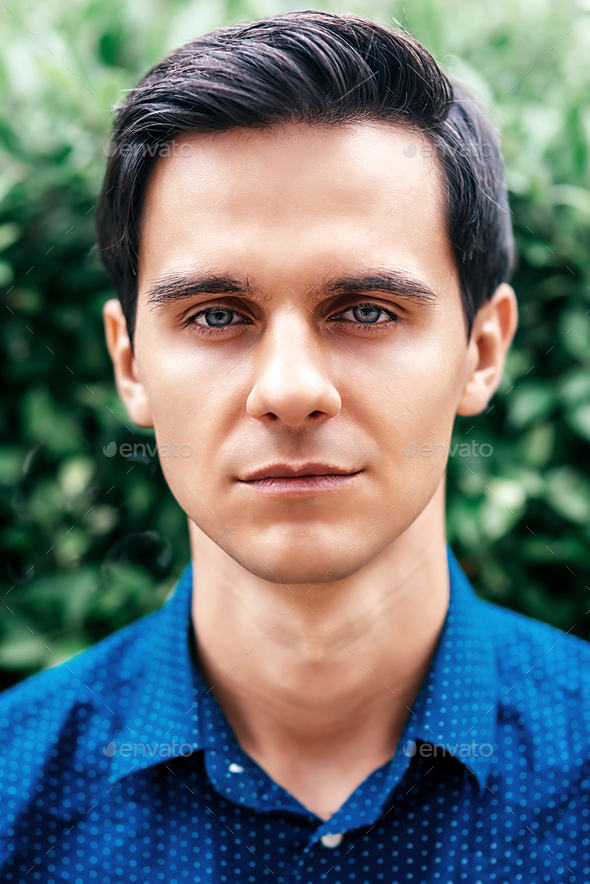 Portrait Of A Nice Young Attractive Man With Blue Eyes Stock Photo