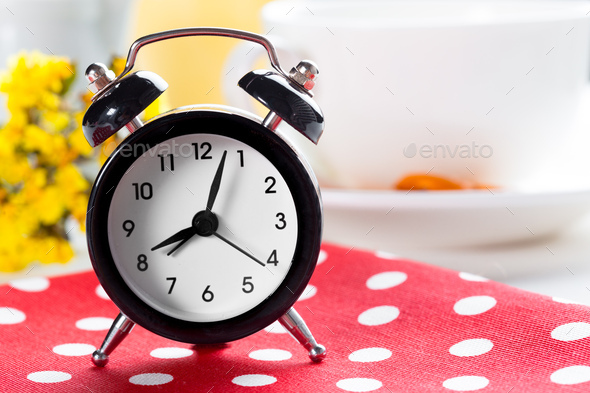 Spring Time Change Background with alarm clock and flower branches - Stock Photo - Images