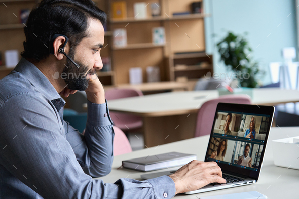 Indian business man having virtual team meeting on video conference call.