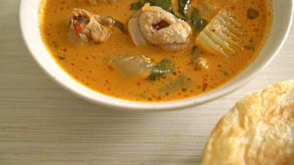 Chicken curry soup with roti or naan with chicken tikka masala - Asian food style alt