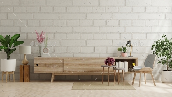 Cabinet for tv in living room with brick wall. Stock Photo by vanitjan