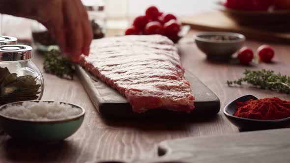 Woman Chef Cooking Ribs Closeup alt