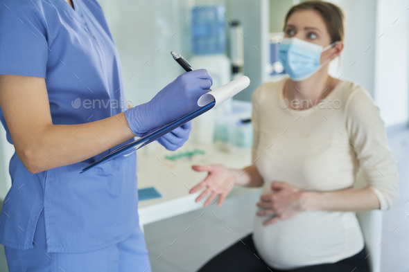 Close up of pregnant woman during a medical interview