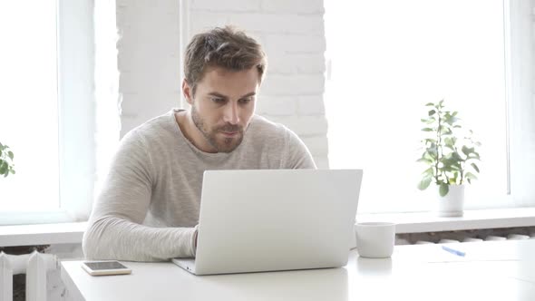 Shocked Businessman Working on Laptop Astonished alt