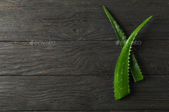 Aloe vera leaves on wooden background, space for text. Natural treatment  Stock Photo by AtlasComposer