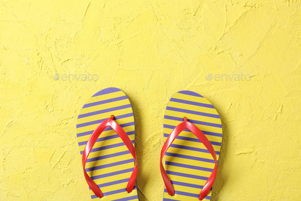 Flip flops on color background, space for text and top view. Summer  vacation backdrop Stock Photo by AtlasComposer