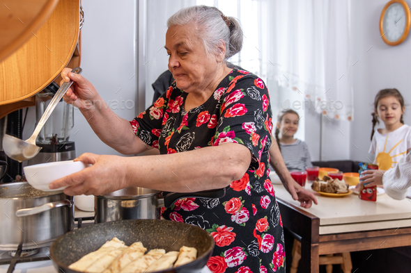 Grandmother treats her grandchildren to a delicious homemade lunch ...