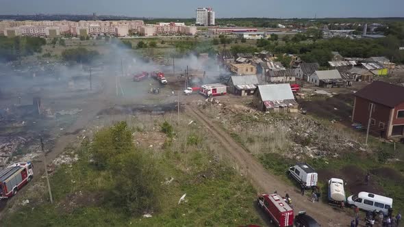 Aerial View of Fire in Village, Fire Engines Are Parked Near, Smoke and Smouldering Ruins