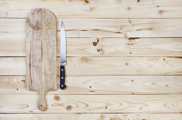 Cutting board on dark wood background, top view Stock Photo by xamtiw