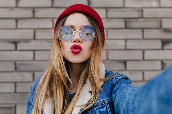 Adorable Caucasian Girl With Straight Hairstyle Posing With Kissing