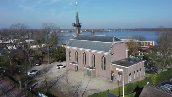 Loosdrechts Church in the Netherlands tilt shot view at Vuntus lake alt