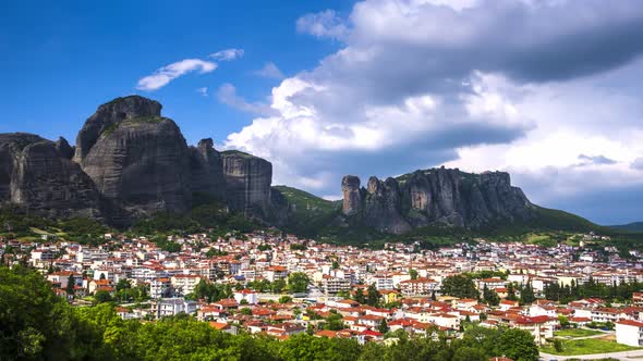 Timelapse view of Meteora rocks over Kalambaka village in Greece at daytime with great clouds