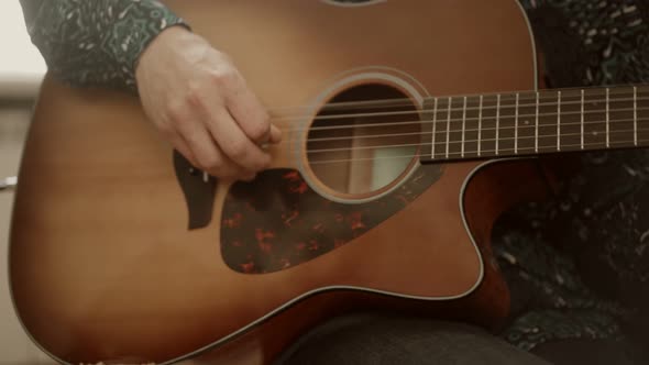 Crop Man Playing Acoustic Guitar