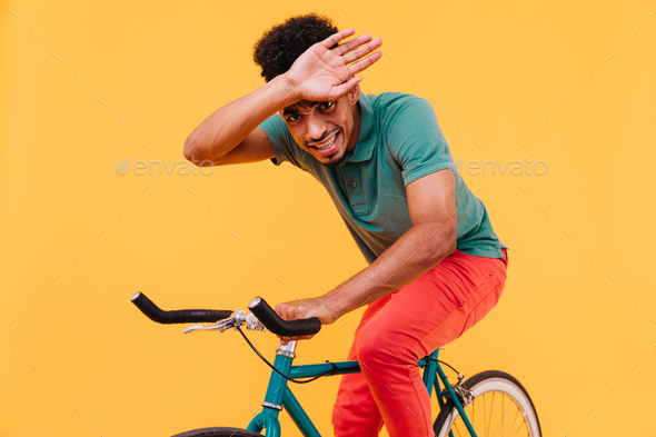young man poses on his bike stuck on the road Stock Photo - Alamy
