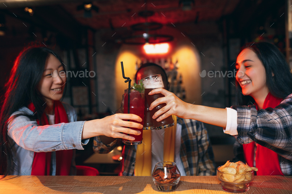 Group of friends watching sport match together. Concept of friendship, leisure activity, emotions - Stock Photo - Images