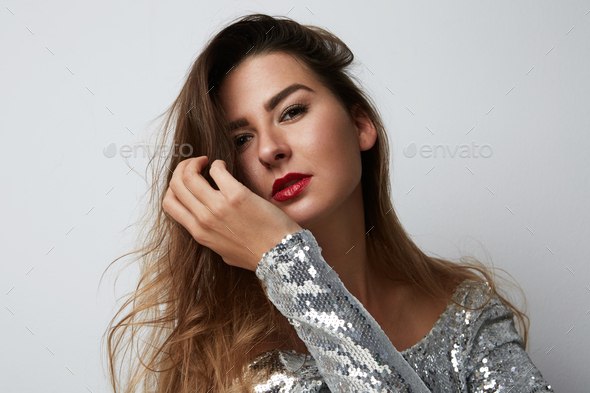 Portrait Of Cheerful Young Beatiful Woman Wearing Silver Dress And ...