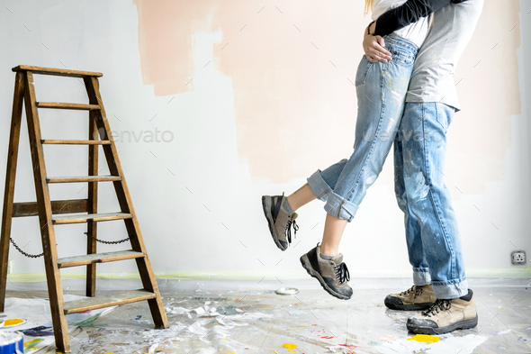 Happy couple renovating the house