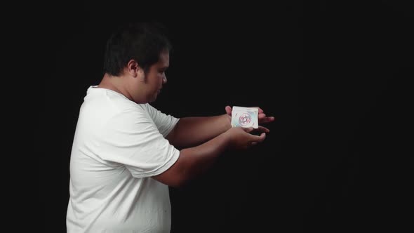 Asian Magician Starts Showing His Trick With Cards, Cards Cascading Down alt