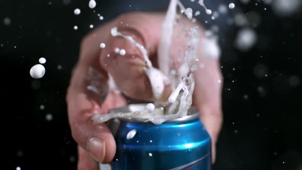 Slow motion of aluminum can opening and spraying as tab is being pulled alt
