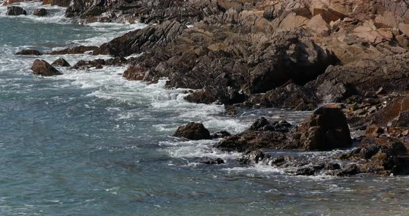 Sea wave on the rock alt