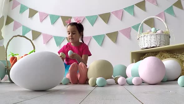Cute Little Girl Painting Colorful Easter Eggs