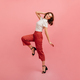 Inspired slim girl dancing on pink background. Studio shot of graceful trendy woman in black shoes. - PhotoDune Item for Sale
