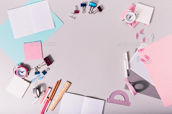 Creative mess on white background. Stationery of pastel shades are in circle.