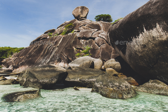 Rocky coast of paradise island with transparent crystal and clear water. Vacation in Similan - Stock Photo - Images