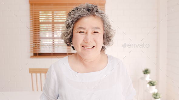 Asian elderly woman feeling happy smiling and looking to camera. - Stock Photo - Images
