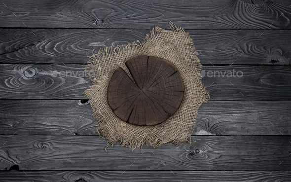 Cutting board on dark wood background, top view Stock Photo by xamtiw