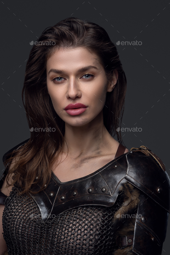 Portrait of woman viking in steel armor - Stock Photo - Images