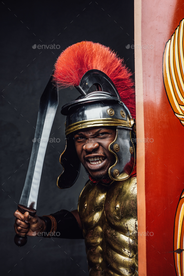 Proud roman warrior of african descent holding gladius