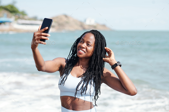 Fit woman taking selfie Stock Photo by DragonImages | PhotoDune