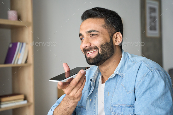 Young Indian Man Speaking To Voice Assistant Using Smartphone Stock Photo By Insta Photos