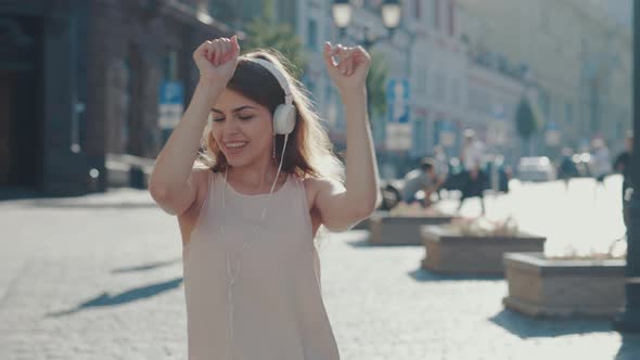 Smiling girl dancing  alt