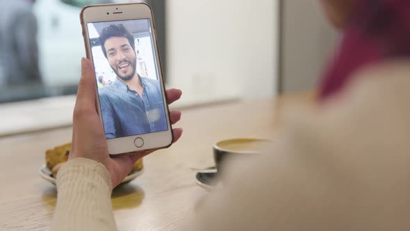 Video call. Close up hand with video chat on mobile phone screen alt