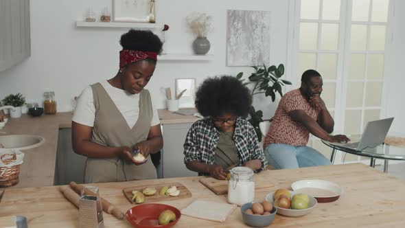 African-American Family of Three in Kitchen alt