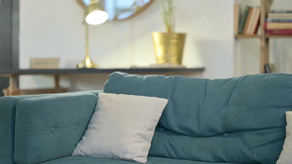 Young African Man Coming Back Opening Laptop From Sofa alt