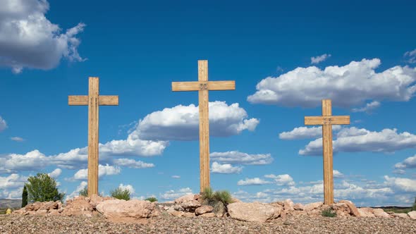 Three Christian Crosses with Cumulus Clouds Timelapse Zoom Out